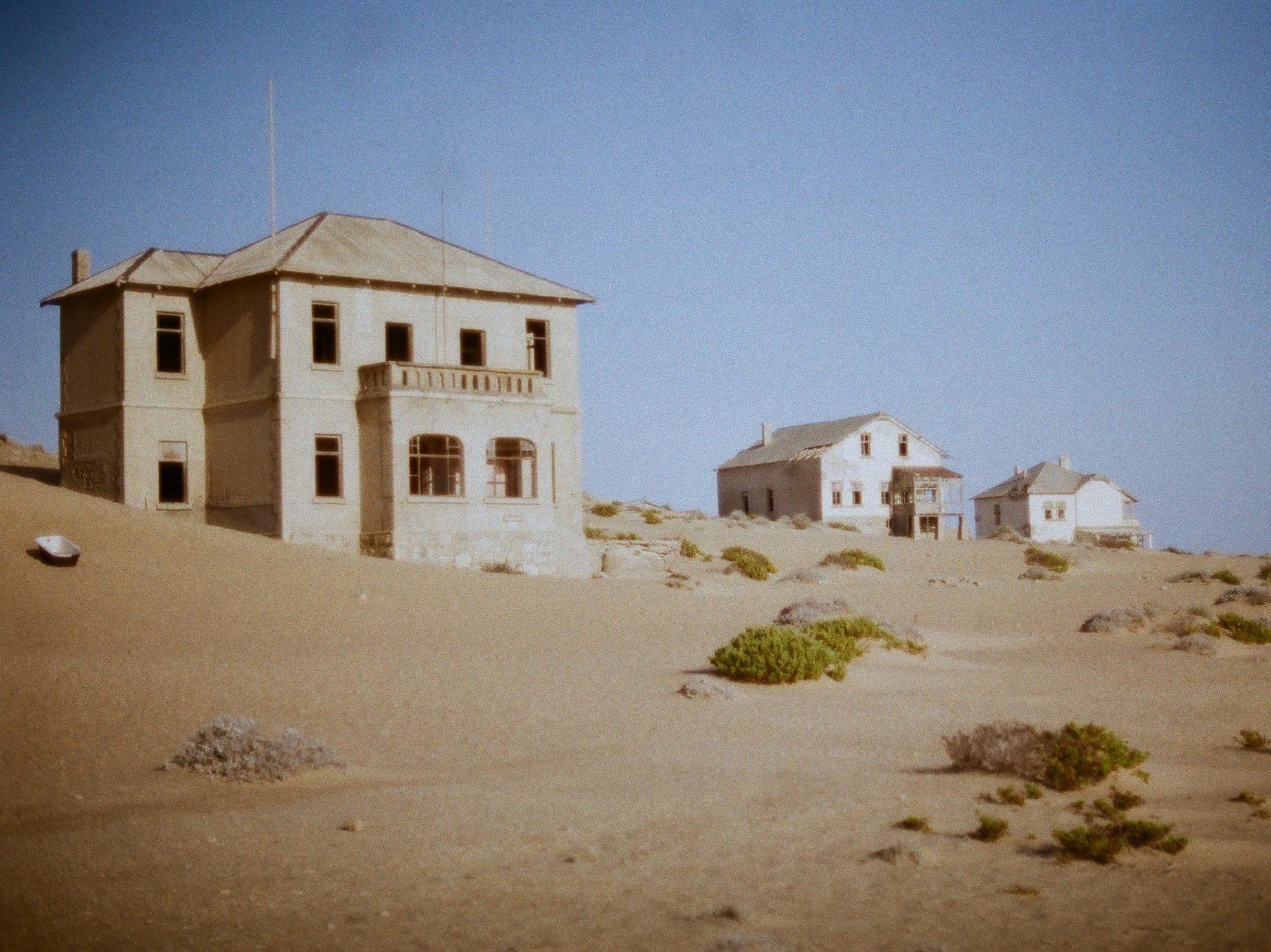 The abandoned mansions of Kolmanskop ghost town, half swallowed by desert sand